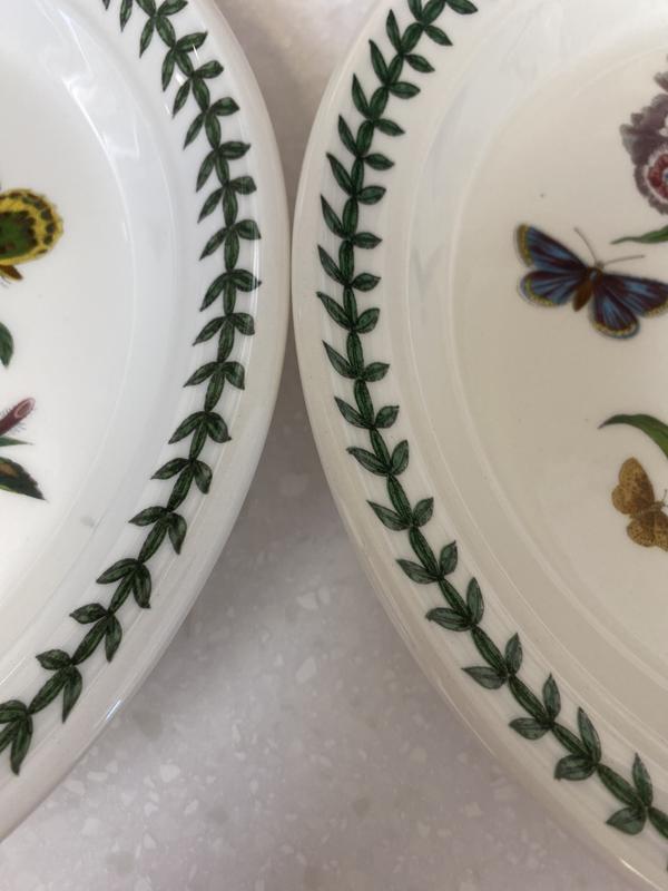 The vine around the outside extends up over the lip.