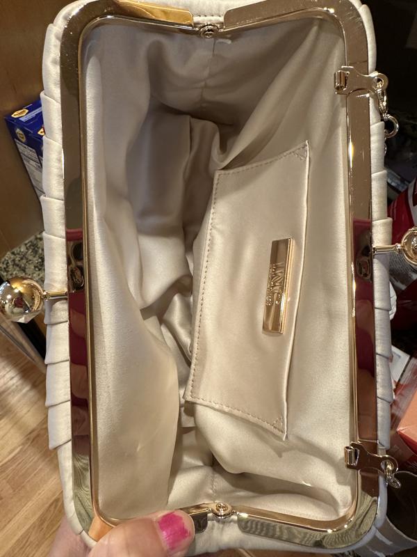 Inside has a pocket that doesn’t have a closure or magnet closure to it