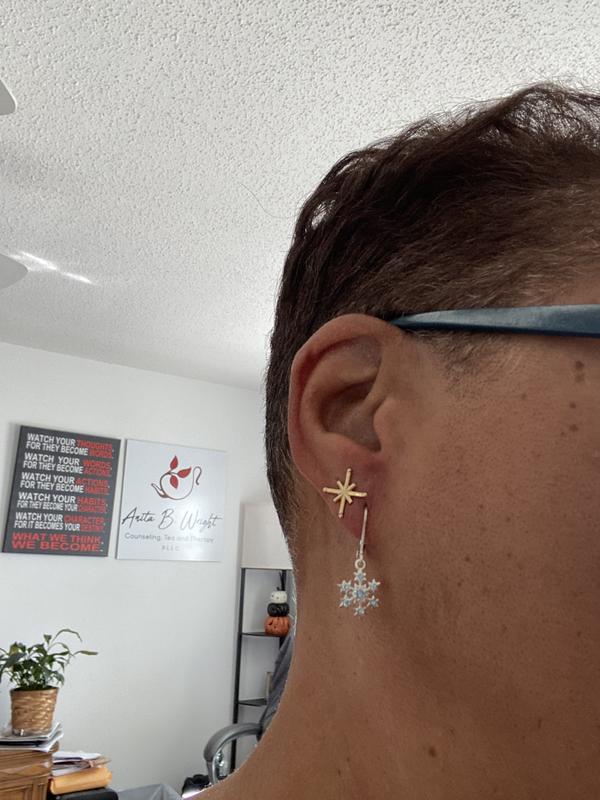 Two earrings spaced simply. Great with short haircut styles.