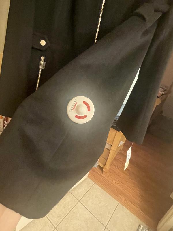 Security Tag left on Coat.