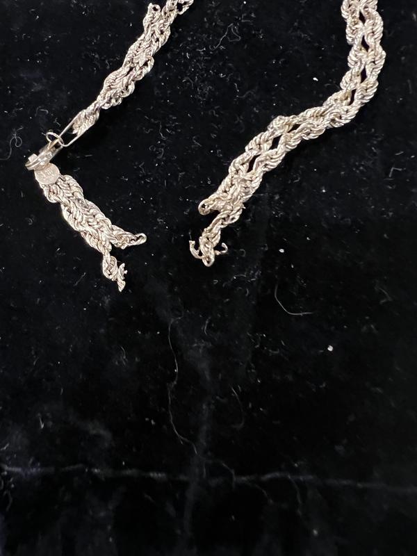 Bracelet torn apart in three places plus there are a few sharp points from other tears.