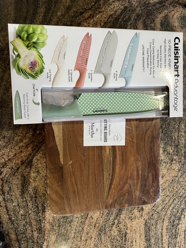 Picked up chopping board and kitchen cutlery
