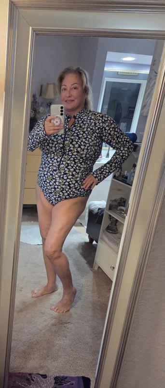 I can't get out of it without help when it's wet, the sleeves are too tight and long, I may have to cut them above the elbow?