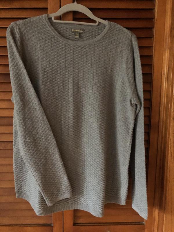 The top is shown alone and also under a vest as a layering piece.