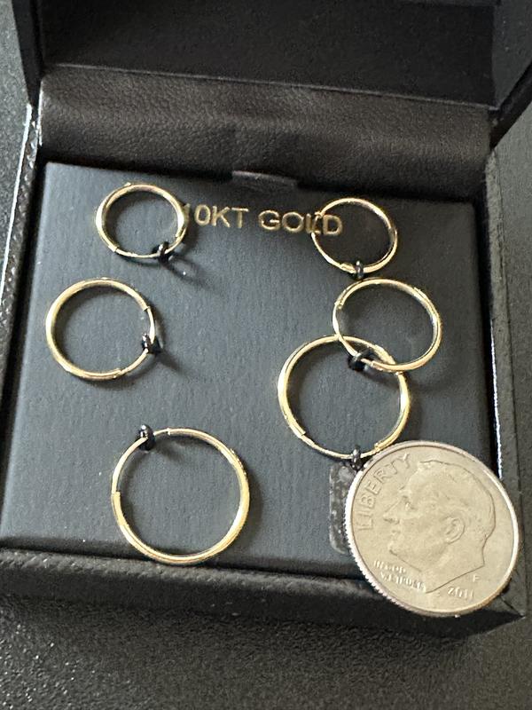 Earrings shown compared to a US dime