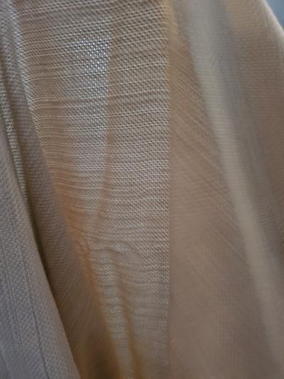 Held up to the light to see thickness