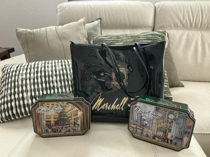 Candy tins with my Marshall fields tote on my (Macys) sofa!