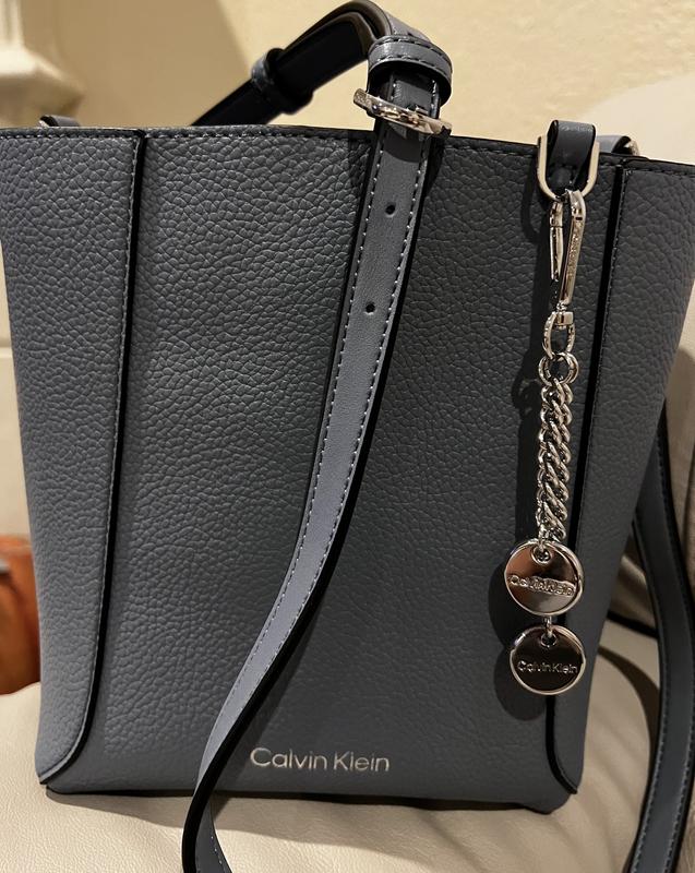 The front of the handbag, showing the adjustable strap.