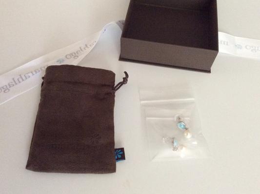 Cloth bag, earrings packed separately