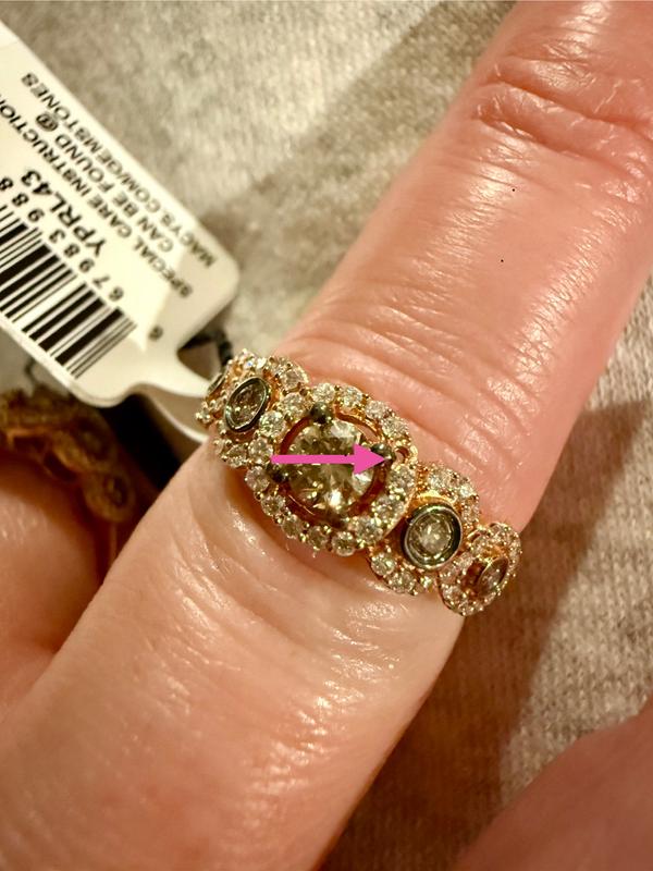 arrows pointing to missing diamonds, purchase tags still in tact