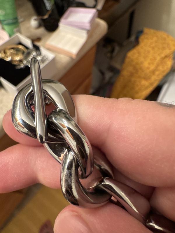 The necklace looks dirty and tarnished but that is just the coating and paint on it. Not good