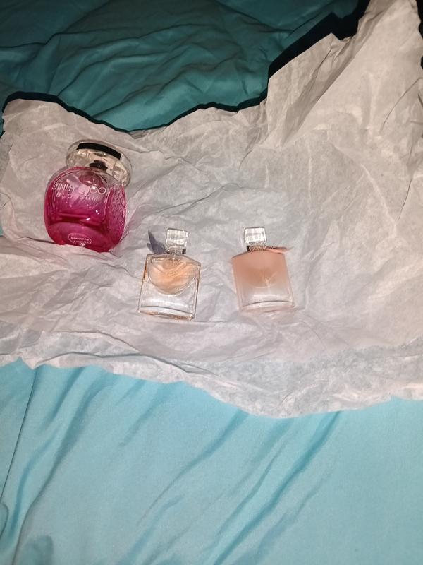 Placed next to a full size bottle of perfume just to show you what size the samples are.