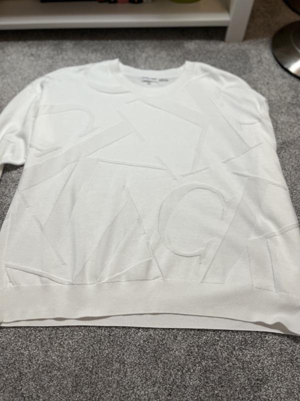 Note Logo, it is on entire sweater, including sleeves.