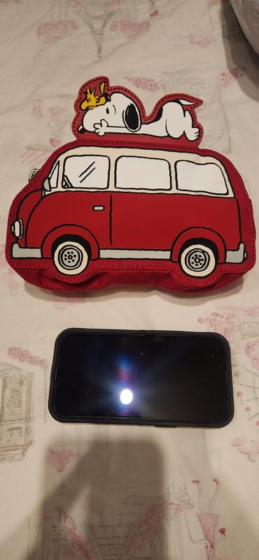 My cell phone next to the bag to show size