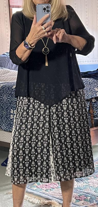 Black sweater top with the skirt, Cream colored silky top with the skirt and Black shear overlay type top paired with the skirt