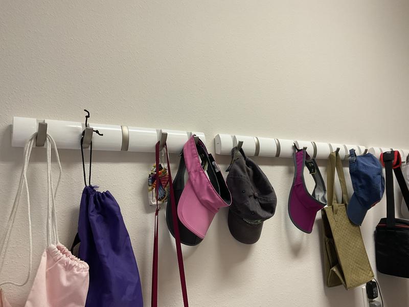 Umbra in white color with nickel hooks.  Work really well in our laundry room.