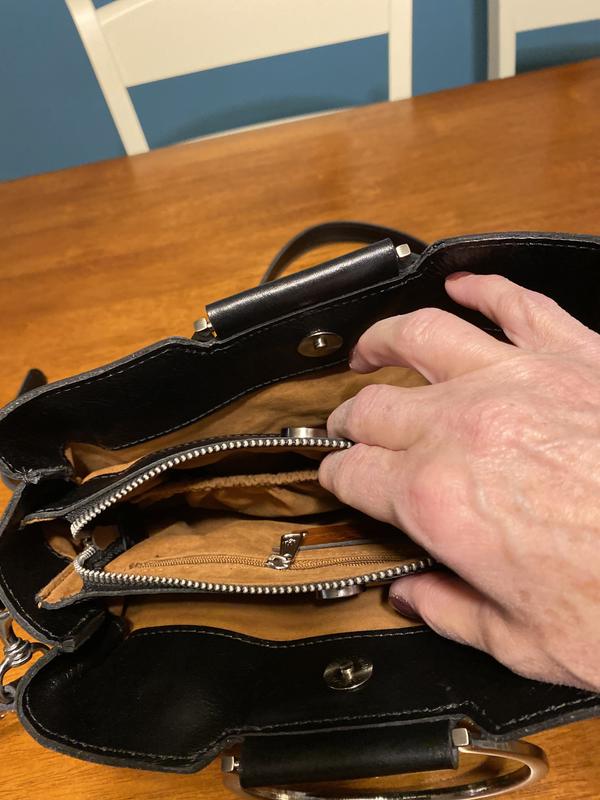 Good quality, nicely lined, and has several compartments.