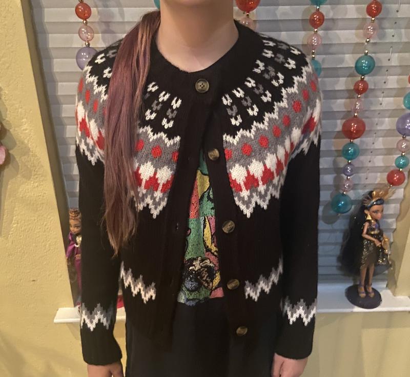 Photos of young and older wearing the sweater.