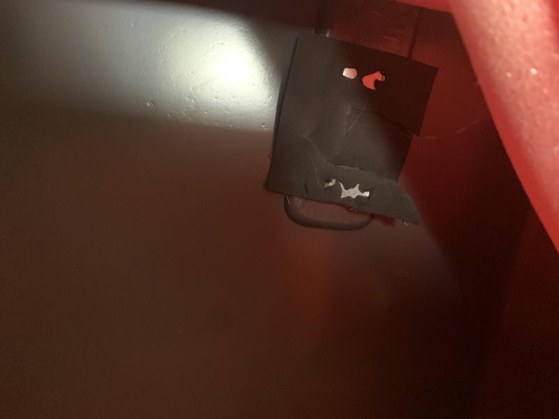 The metal accessory is attached on the inside of the suitcase  with just a black tape that easily came off.