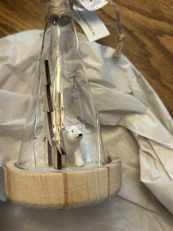 Ornament arrived broken. Globe glass was broken, exposing sharp edges.