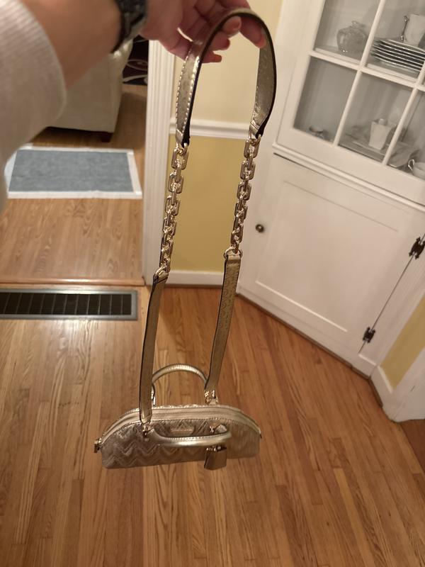 I was thinking when I got it that the strap could’ve been connected to the purse in a better way but when I put it on it is actually just fine! Packaged so nicely when I received the shipment too!