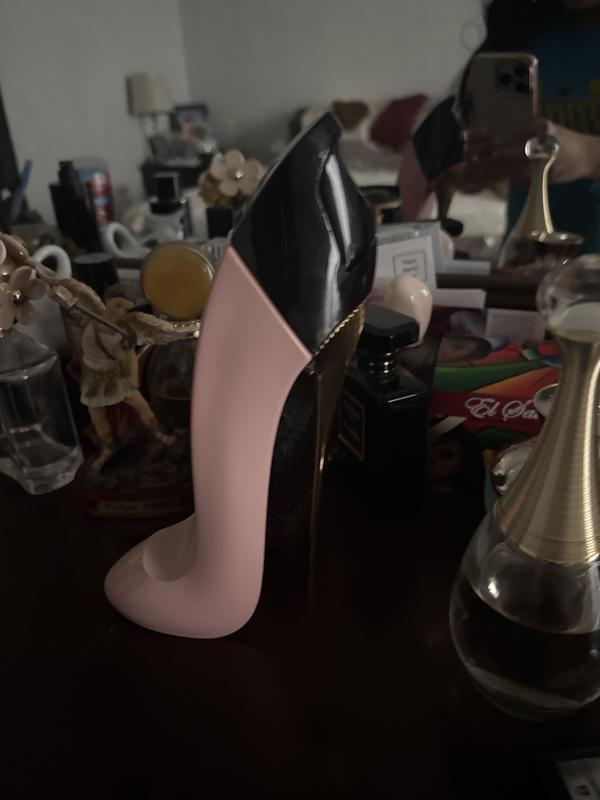 This is a picture of the perfume in front of my mirror and other perfumes.