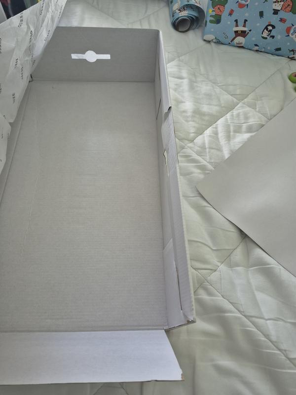 Broken Box and Boots placed inside incorrectly without cover.