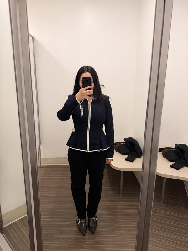 The cinched waist creates a graceful hourglass silhouette, while the design remains impeccably clean and modern yet timeless—exuding femininity and understated quiet luxury.