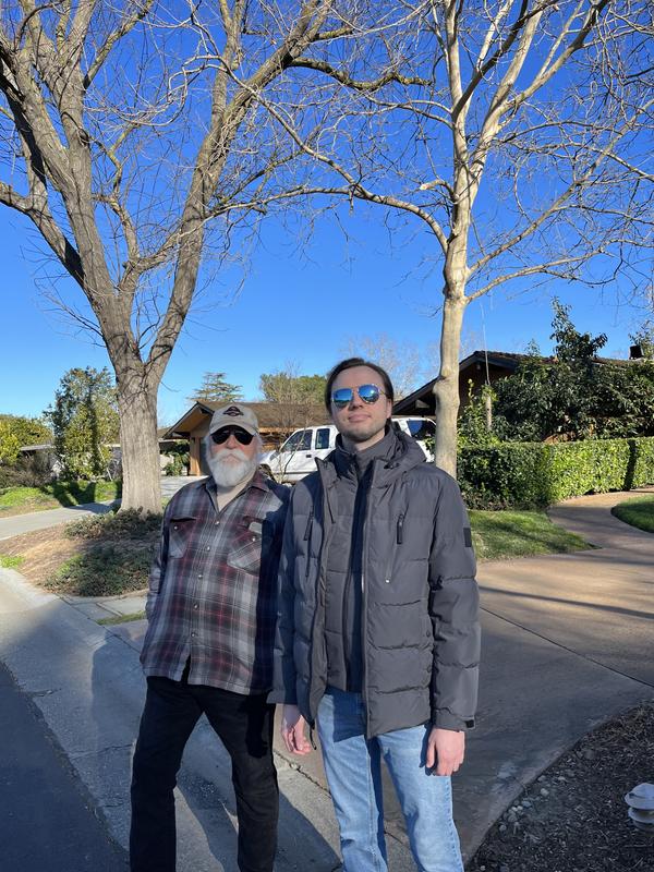 Walking with his dad- coat looks great