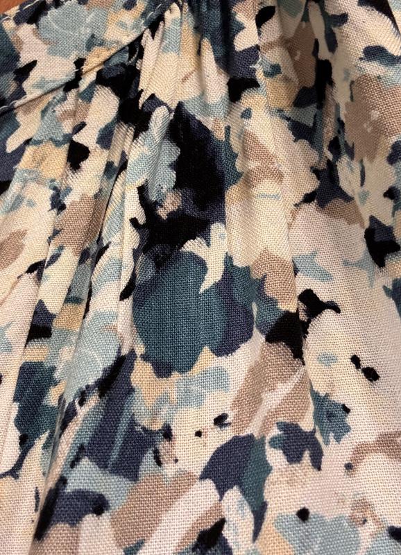 Pleating at neckline is a nice added detail