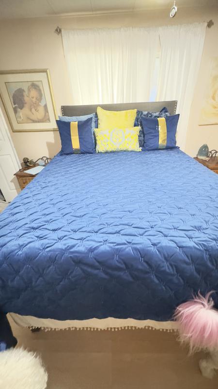 I dressed it up with some pretty pillows, but it’s still cheesy looking