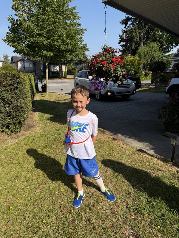 Posing in his matching shirt shorts and shoes
