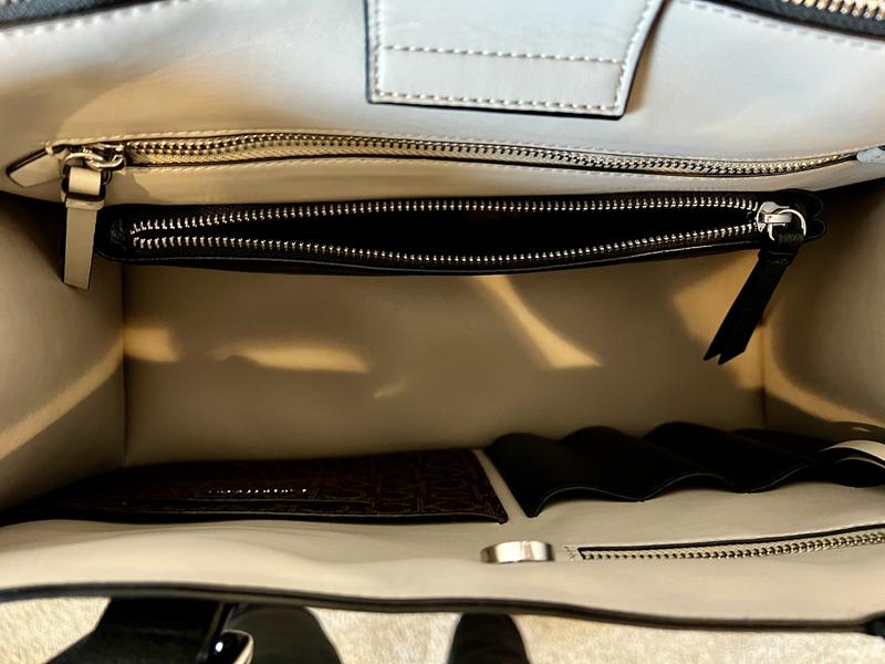 Organization inside plus a separate zipper compartment to hold a laptop or tablet.  Nice!