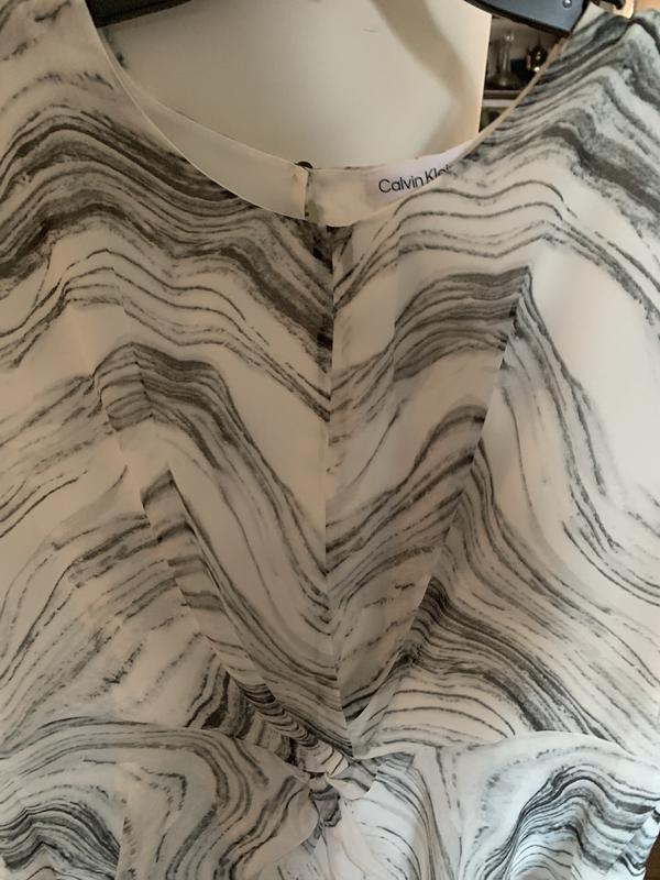 Very pretty, lovely material, runs small