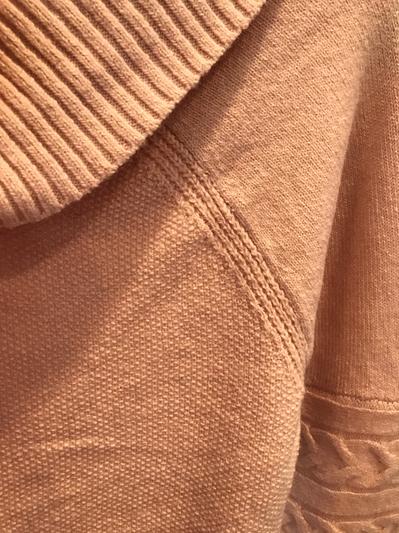 Shawl collar of one knit and sweater body of a different knit