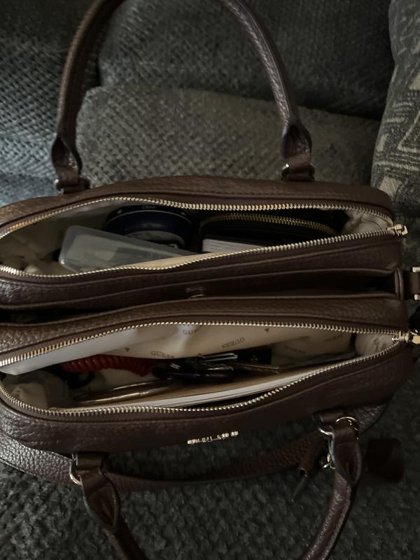 The size space pockets, shoulder strap arm hold ladies this is a must have for your wardrobe. I love love love this bag.