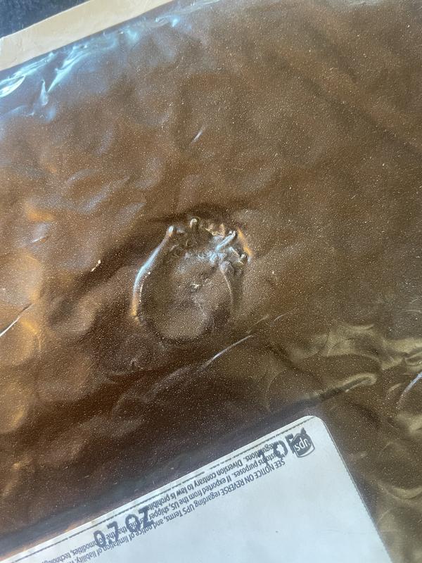 You can see the indent of the ring on the packaging where it got crushed during shipment