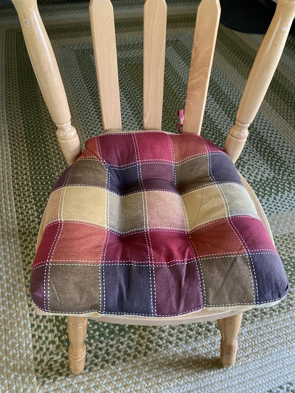 If I tied the strings to the outer peg the cushion didn’t sit all the way to the back of the chair.