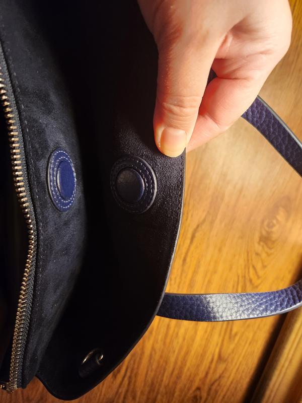 Magnetic closure on each side.