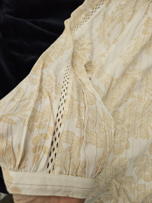 Cutouts down front and sleeves (sleeve pictured)