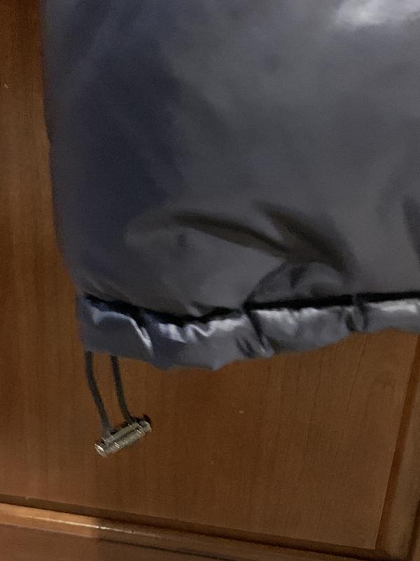 Adjustable toggles at bottom of coat