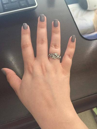 The ring worn on a small/medium hand size.