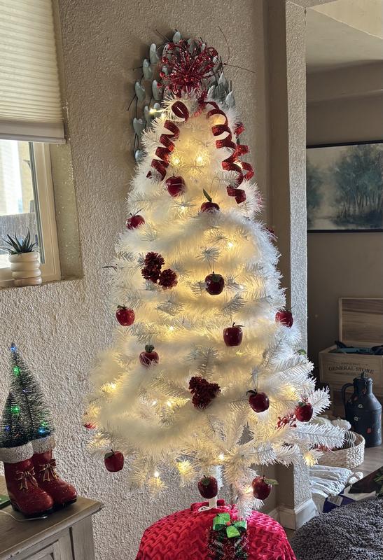 The white boa makes the tree look very full and fluffy. I used red accents. Not quite sure if the apples will stay on the tree, but it has been fun to decorate.