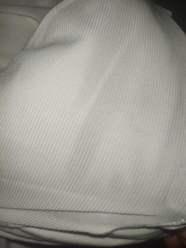 The backing of the pillowtop