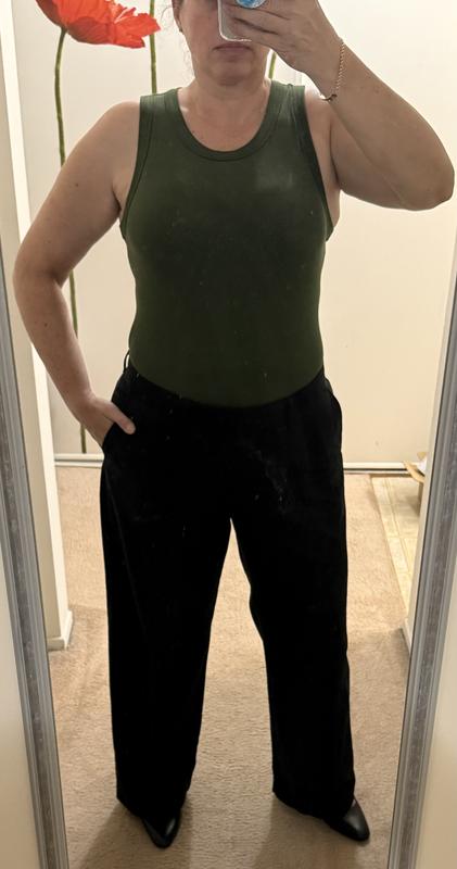Bodysuit with black wide leg pants.