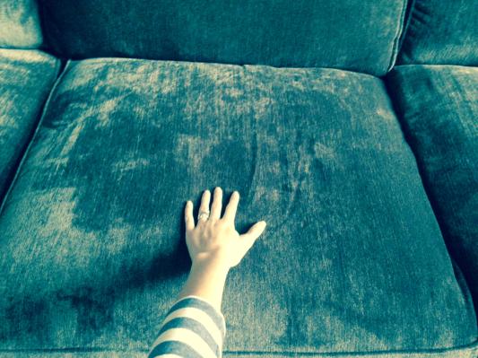 I put my hand on the cushion for perspective to see just how large the seat cushions are!