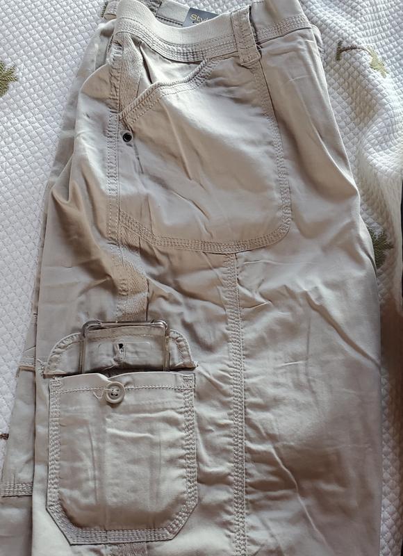Cell phone case in pocket to show size too small for phone.