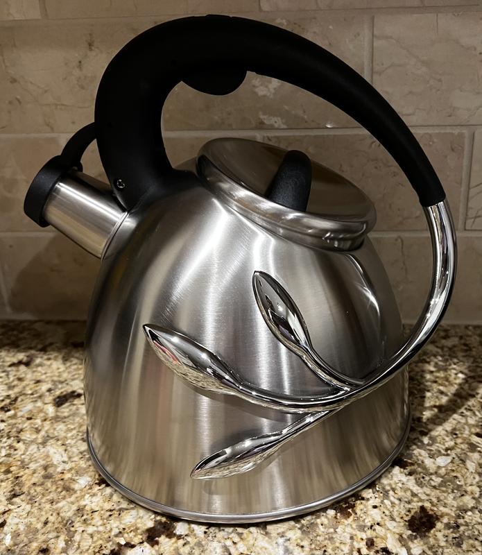 Side of the kettle with the vine.