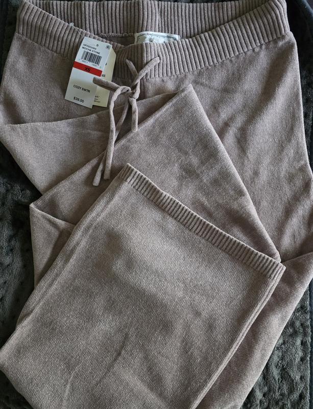 Lightweight yet cozy.  The hem adds a touch of style.