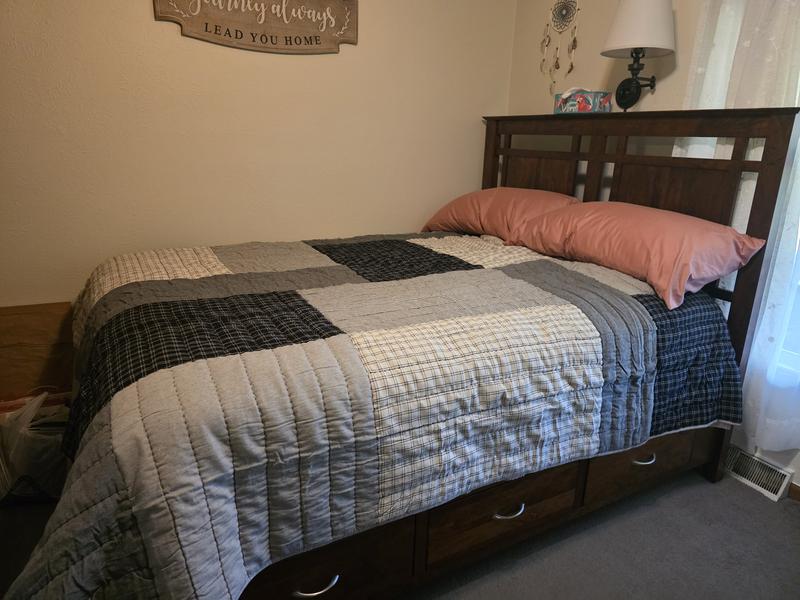 Queen size fits bed nicely with sufficient overhang.